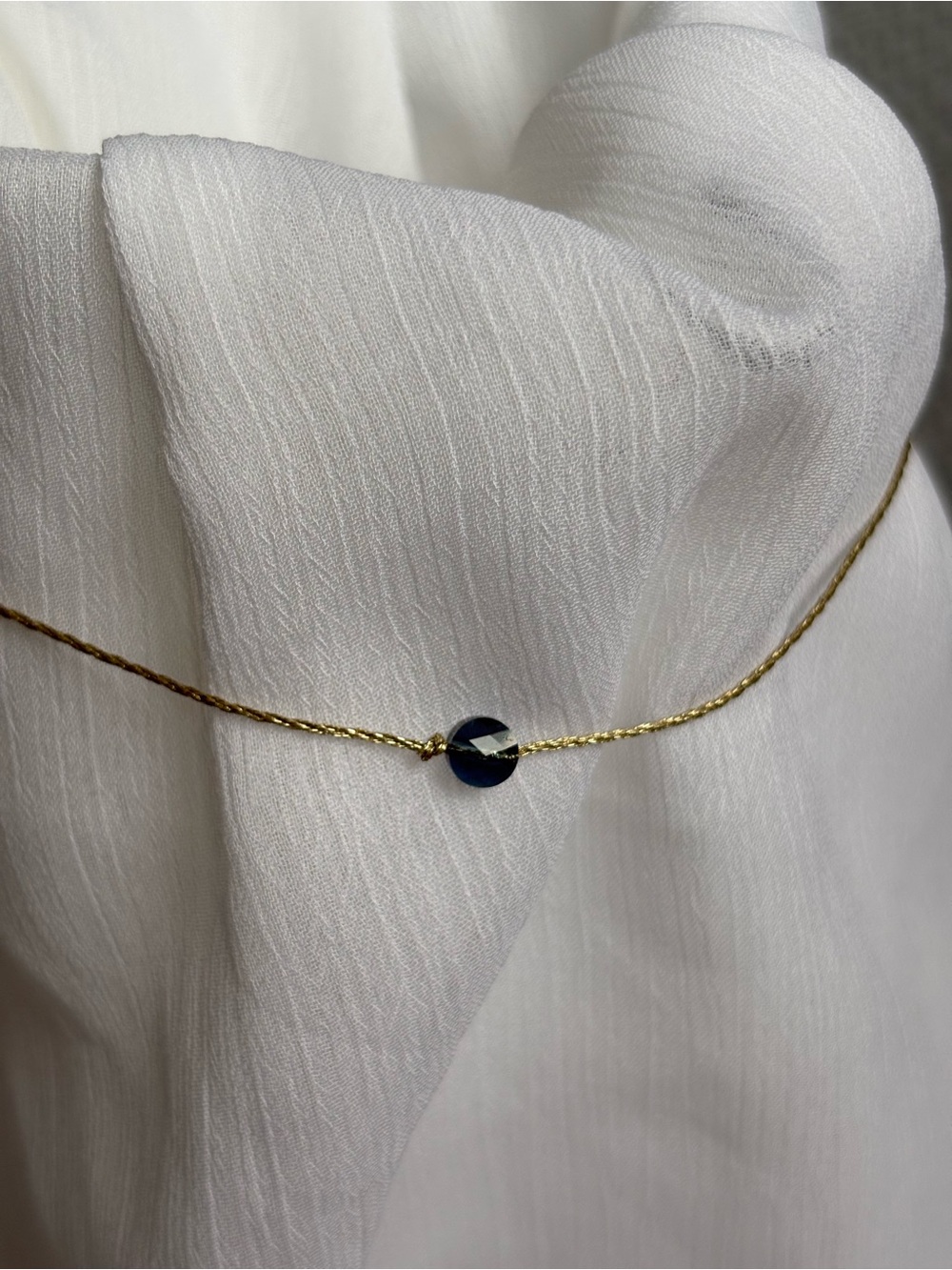 Delicate Gold Chain Necklace with Dark Blue Bead